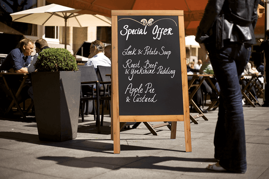 How Pavement Signs Can Boost Service Promotions and Hospitality Advertising