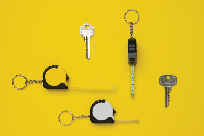 Load image into Gallery viewer, MeasureMate RCS reycled ABS 1 meter tape keychain - Custom Wood Designs
